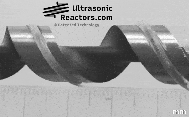 Helical capillary sonoreactor units vibrating